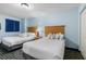Comfortable bedroom featuring two beds, nightstand, and window, creating a welcoming and restful space at 2201 S Ocean Blvd. # 1707, Myrtle Beach, SC 29577