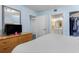 Cozy bedroom with a television, closet, and a view of the en-suite bathroom through the doorway at 2201 S Ocean Blvd. # 1707, Myrtle Beach, SC 29577