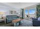 Comfortable living room with stylish furniture and a sliding glass door to a balcony with ocean views at 2201 S Ocean Blvd. # 1707, Myrtle Beach, SC 29577