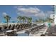 Pool deck featuring lounge chairs, tables, palm trees, and umbrellas overlooking the scenic beachfront at 2201 S Ocean Blvd. # 1707, Myrtle Beach, SC 29577