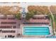 Aerial view of a community pool with lounge chairs, and palm trees at 2201 S Ocean Blvd. # 1707, Myrtle Beach, SC 29577