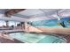 Indoor pool area featuring a mural, ocean view, and calming ambiance for relaxation and leisure at 2201 S Ocean Blvd. # 1707, Myrtle Beach, SC 29577