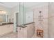 Modern bathroom featuring a walk-in tiled shower, vanity with granite counters and neutral decor at 2212 Via Palma Dr., North Myrtle Beach, SC 29582