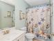 Stylish bathroom featuring a vanity, decorative shower curtain, and nautical-themed accents at 2212 Via Palma Dr., North Myrtle Beach, SC 29582
