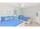 Bright bedroom with two twin beds, coastal decor, and a ceiling fan, creating a relaxing beachside ambiance at 2212 Via Palma Dr., North Myrtle Beach, SC 29582
