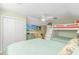 Spacious bedroom featuring a bunk bed, closet, TV and coastal-themed decor, offering comfort and style at 2212 Via Palma Dr., North Myrtle Beach, SC 29582
