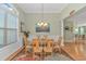 Elegant dining room with a chandelier, a large window, and a coastal-themed decor at 2212 Via Palma Dr., North Myrtle Beach, SC 29582