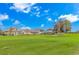 Scenic view of homes overlooking the golf course and green spaces under a beautiful blue sky with fluffy clouds at 2212 Via Palma Dr., North Myrtle Beach, SC 29582