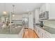 A bright eat-in kitchen with stainless steel appliances, an island and wood flooring at 2212 Via Palma Dr., North Myrtle Beach, SC 29582