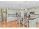 A bright eat-in kitchen with stainless steel appliances, an island and wood flooring at 2212 Via Palma Dr., North Myrtle Beach, SC 29582