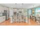 A kitchen with wooden floors, an island with seating, granite counters and stainless steel appliances at 2212 Via Palma Dr., North Myrtle Beach, SC 29582