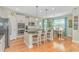 A kitchen with wooden floors, an island with seating, granite counters and stainless steel appliances at 2212 Via Palma Dr., North Myrtle Beach, SC 29582
