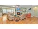 Cozy living room with hardwood floors, fireplace, and comfortable seating at 2212 Via Palma Dr., North Myrtle Beach, SC 29582