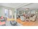 Bright living room with comfortable wicker seating and access to outdoor patio via sliding glass doors at 2212 Via Palma Dr., North Myrtle Beach, SC 29582