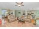 Spacious living room featuring hardwood floors, open layout, and access to the dining area at 2212 Via Palma Dr., North Myrtle Beach, SC 29582