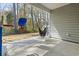 Covered back patio with outdoor seating, play set and paved walkway, great for entertaining at 236 Craigflower Ct., Longs, SC 29568