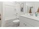 Clean, bright bathroom with a shower-tub combo, white vanity, and neutral decor at 236 Craigflower Ct., Longs, SC 29568