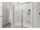 Modern bathroom featuring a glass shower with white tile surround and built-in shelving at 236 Craigflower Ct., Longs, SC 29568