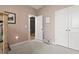 Bright bedroom featuring paneled walls, plush carpeting and a glimpse of another room at 236 Craigflower Ct., Longs, SC 29568