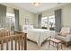 Bright bedroom with natural light, neutral tones, and a cozy atmosphere at 236 Craigflower Ct., Longs, SC 29568