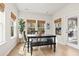 Sunlit dining area features natural light with wood-look flooring and casual dining set at 236 Craigflower Ct., Longs, SC 29568