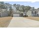 Charming single-Gathering home boasts stone accents, a two-car garage, and a concrete driveway at 236 Craigflower Ct., Longs, SC 29568