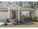 Charming home with stone facade, landscaped front yard and attached garage at 236 Craigflower Ct., Longs, SC 29568