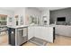 Charming kitchen with white cabinets, stainless steel appliances, and granite countertops at 236 Craigflower Ct., Longs, SC 29568