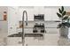 A modern kitchen featuring stainless steel appliances, granite countertops, and white cabinets at 236 Craigflower Ct., Longs, SC 29568