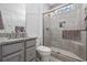 Modern bathroom featuring tiled shower with glass door, granite countertops, and stylish fixtures at 2406 Seabreeze Pl., Myrtle Beach, SC 29577