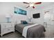 Cozy bedroom with white furniture and ocean-themed wall art at 2406 Seabreeze Pl., Myrtle Beach, SC 29577