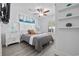 Cozy bedroom with white furniture and ocean-themed wall art at 2406 Seabreeze Pl., Myrtle Beach, SC 29577