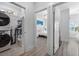 Bright hallway showcasing laundry area and bedroom, offering a glimpse into the layout of the house at 2406 Seabreeze Pl., Myrtle Beach, SC 29577