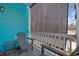 Inviting porch with comfortable seating and a retractable screen for shade and privacy at 2406 Seabreeze Pl., Myrtle Beach, SC 29577