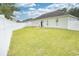 View of the backyard showing the vinyl fence and green lawn at 264 La Patos Dr., Myrtle Beach, SC 29588