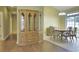 Open-concept dining room with neutral walls, an adjacent cabinet, and lots of natural light at 264 La Patos Dr., Myrtle Beach, SC 29588