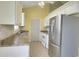 Bright kitchen with tile floors, stainless steel appliances, and white cabinets at 264 La Patos Dr., Myrtle Beach, SC 29588