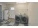 Spacious laundry room features a washer, dryer, and water heater at 264 La Patos Dr., Myrtle Beach, SC 29588
