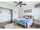 Bedroom featuring a ceiling fan, a window, wood floors, and ensuite bathroom at 2668 Corn Pile Rd., Myrtle Beach, SC 29588
