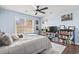 Bedroom with a ceiling fan, a window, wood floors, and a TV at 2668 Corn Pile Rd., Myrtle Beach, SC 29588