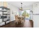 Bright dining room featuring hardwood floors, modern light fixture and glass sliding doors with backyard views at 2668 Corn Pile Rd., Myrtle Beach, SC 29588