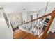 Bright foyer featuring hardwood staircase, natural light, and view into open-concept living area with fireplace at 2668 Corn Pile Rd., Myrtle Beach, SC 29588