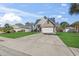 Beautiful home with a long driveway, two-car garage, and green lawn at 2668 Corn Pile Rd., Myrtle Beach, SC 29588
