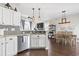 Open-concept kitchen and dining area with modern stainless steel appliances and views to living room at 2668 Corn Pile Rd., Myrtle Beach, SC 29588