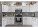 Kitchen showcasing stainless steel range and microwave, plus ample counter and cabinet space at 2668 Corn Pile Rd., Myrtle Beach, SC 29588