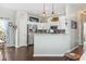 Modern kitchen with white cabinets, stainless steel appliances, and a peninsula at 2668 Corn Pile Rd., Myrtle Beach, SC 29588