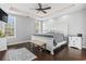 Bright main bedroom with trey ceiling, ceiling fan, wood floors, and windows at 2668 Corn Pile Rd., Myrtle Beach, SC 29588