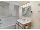 Well-lit bathroom with a shower, tub, vanity, and necessary amenities for comfort and convenience at 2701 S Ocean Blvd. # 202, North Myrtle Beach, SC 29582