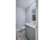 Bathroom features a modern vanity, sleek faucet, wood look floors and a tiled shower at 2705 Mercer Dr. # 2705, Conway, SC 29526
