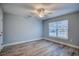 Well-lit bedroom with wood-look tile flooring and a ceiling fan for added comfort at 2705 Mercer Dr. # 2705, Conway, SC 29526